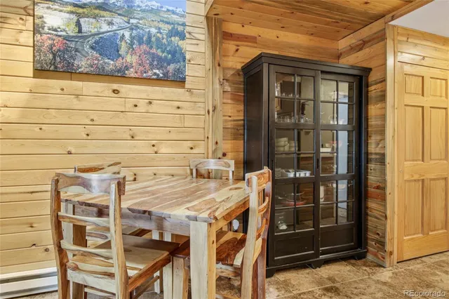 a kitchen with stainless steel appliances granite countertop a refrigerator a stove top oven a sink and dishwasher