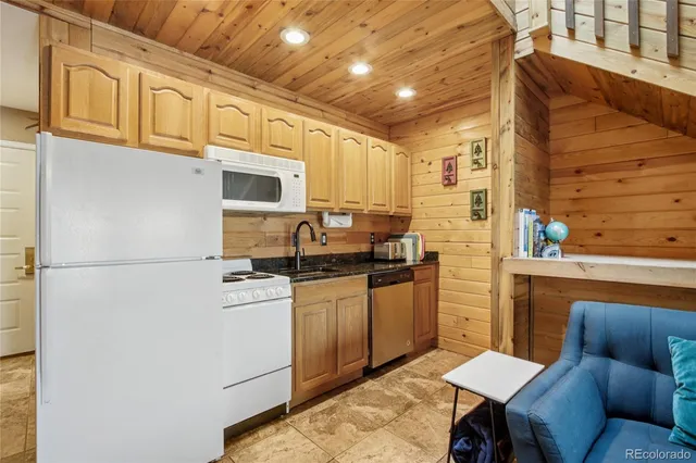 a view of an empty room with furniture and a flat screen tv