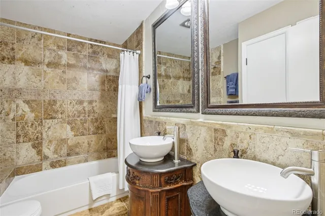 a bathroom with a toilet and a sink