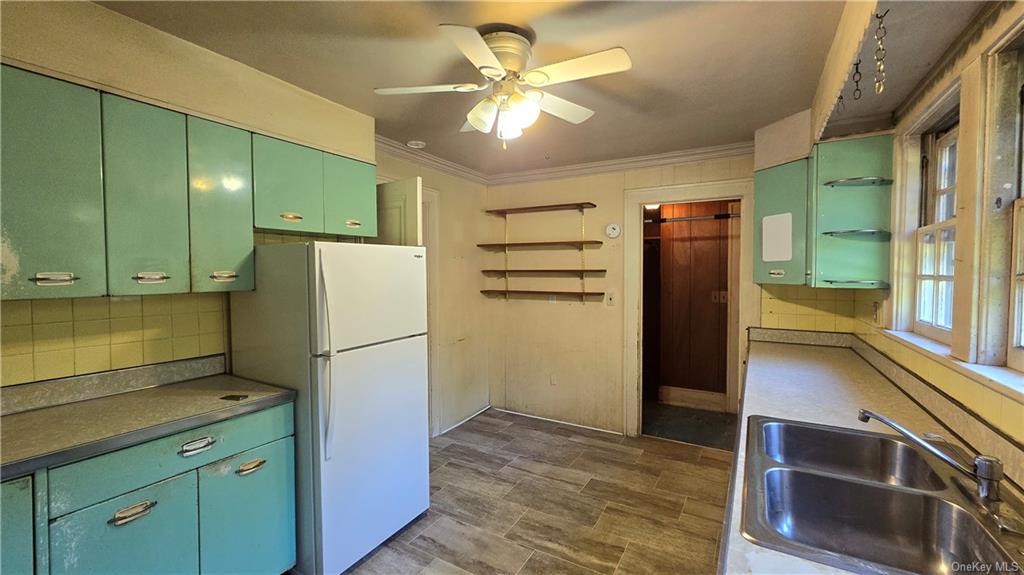 17 Old Mill Road Poughkeepsie, NY 12603 - Photo 22 of 23 a kitchen with refrigerator and cabinets