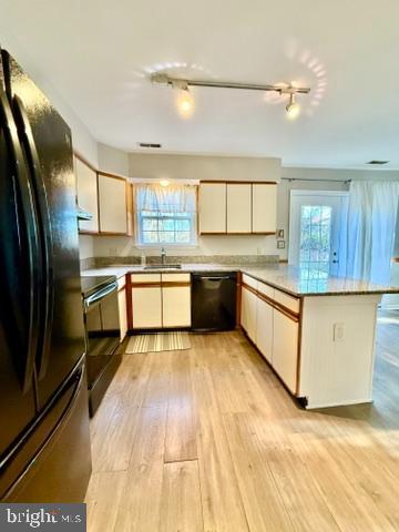 937 Breakwater Drive Annapolis, MD 21403 - Photo 12 of 27 a large kitchen with stainless steel appliances granite countertop a stove refrigerator and cabinets