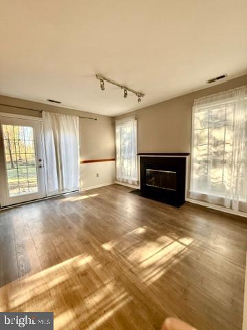 937 Breakwater Drive Annapolis, MD 21403 - Photo 15 of 27 a view of empty room with a fireplace and windows