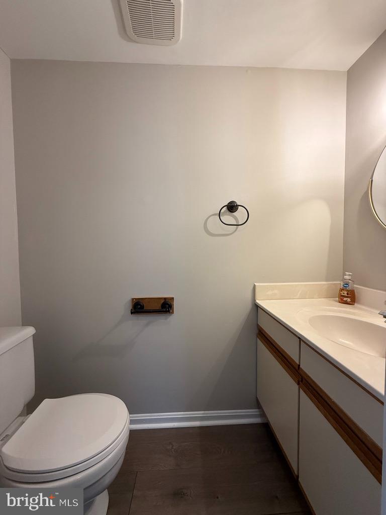 937 Breakwater Drive Annapolis, MD 21403 - Photo 16 of 27 a bathroom with a granite countertop toilet and a sink