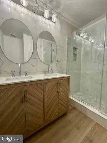 a bathroom with a shower and a sink