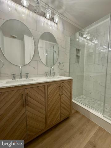 937 Breakwater Drive Annapolis, MD 21403 - Photo 20 of 27 a bathroom with a double vanity sink mirror and shower