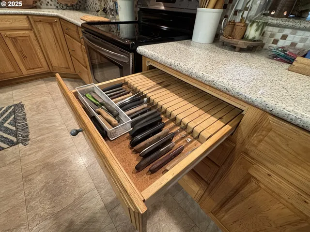 a stove top oven sitting inside of a kitchen