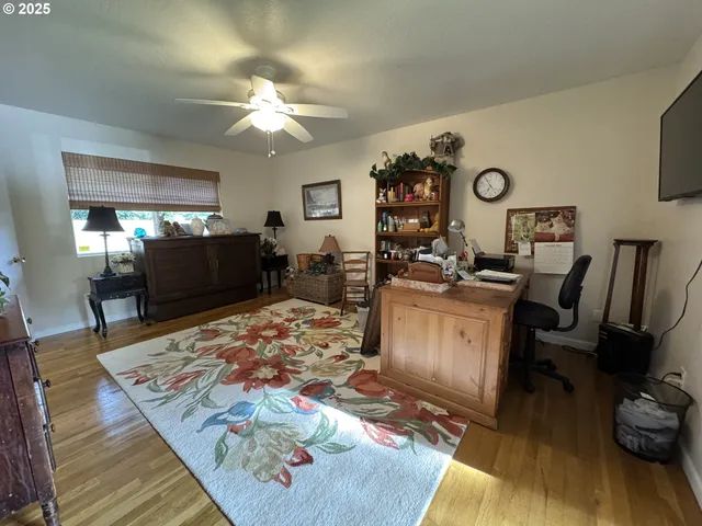 a view of a livingroom with furniture and workspace