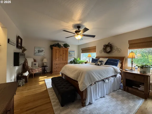 a dining room with furniture water view and a floor to ceiling window