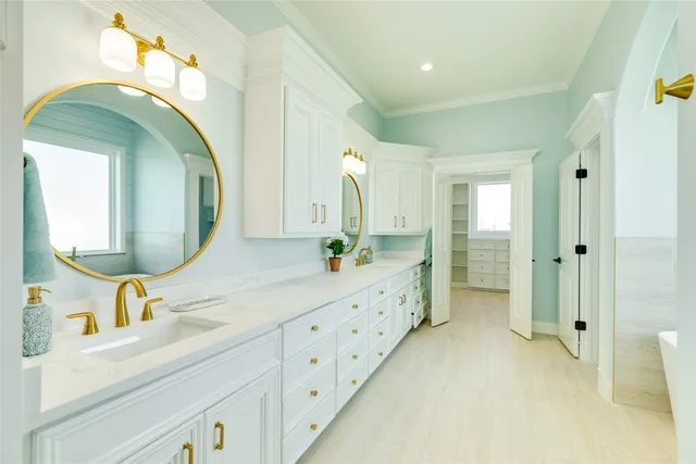 a spacious bathroom with a double vanity sink and a mirror