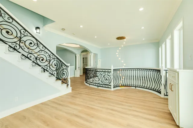 a view of entryway with stairs and wooden floor