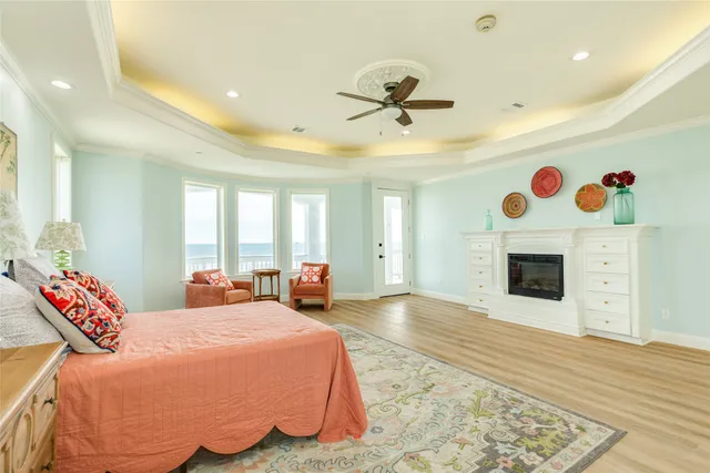 a spacious bedroom with a bed and a fireplace