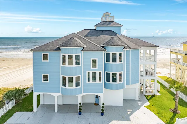 a front view of a house with a yard outdoor seating and barbeque oven