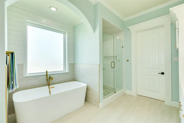 a bathroom with a bathtub and a shower