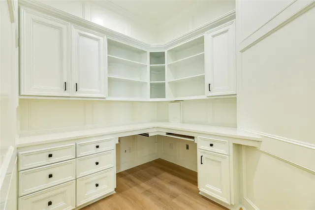 a hallway with cabinets