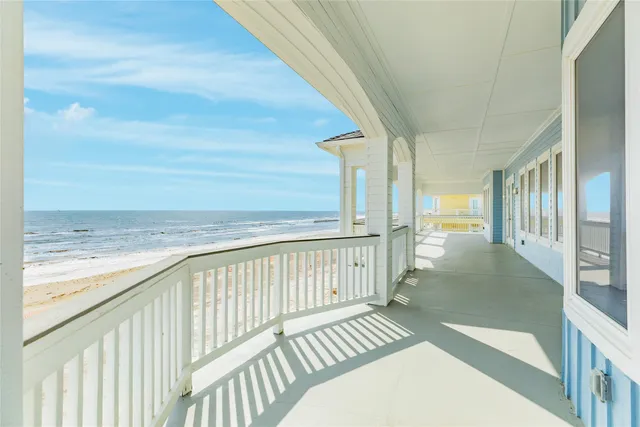 a view of balcony with wooden floor