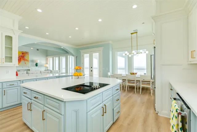 a kitchen that has a table and chairs in it
