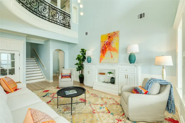 a living room with furniture and rug