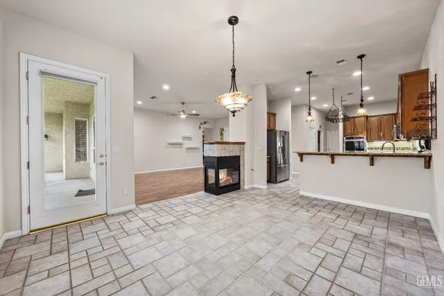 a kitchen with a stove a sink and a microwave