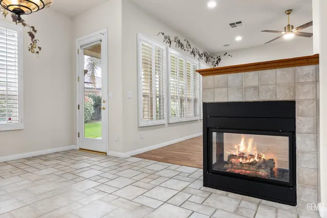 a kitchen with stainless steel appliances granite countertop a sink a stove and a microwave