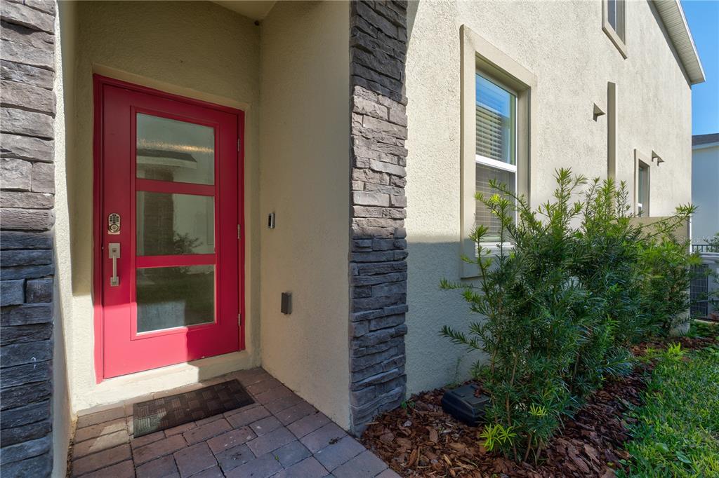 a view of a red door with an outdoor space
