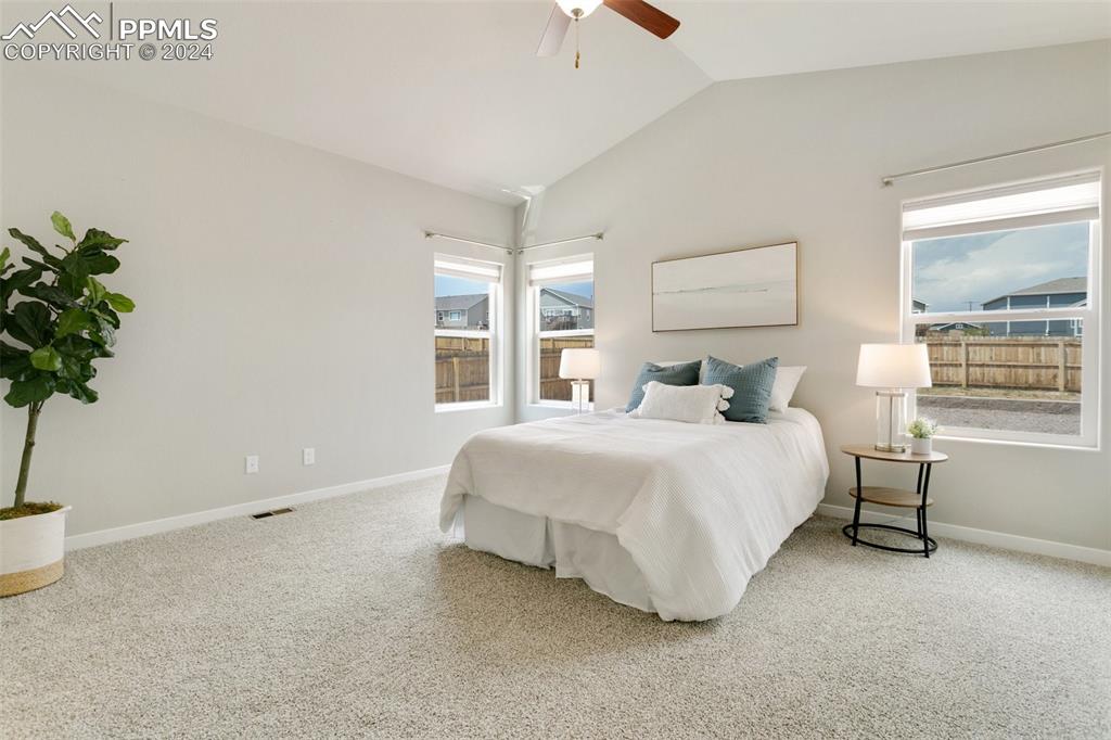 10110 Henman Terrace Peyton, CO 80831 - Photo 13 of 36 a bedroom with a bed and a window