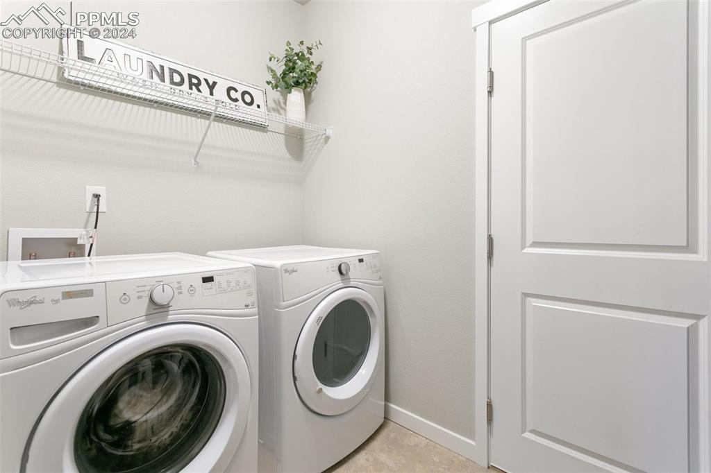 10110 Henman Terrace Peyton, CO 80831 - Photo 21 of 36 a utility room with dryer and washer