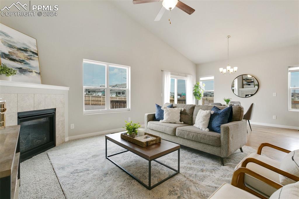 10110 Henman Terrace Peyton, CO 80831 - Photo 3 of 36 a living room with furniture and a fireplace