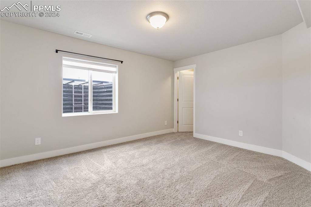 10110 Henman Terrace Peyton, CO 80831 - Photo 31 of 36 a view of an empty room with a window