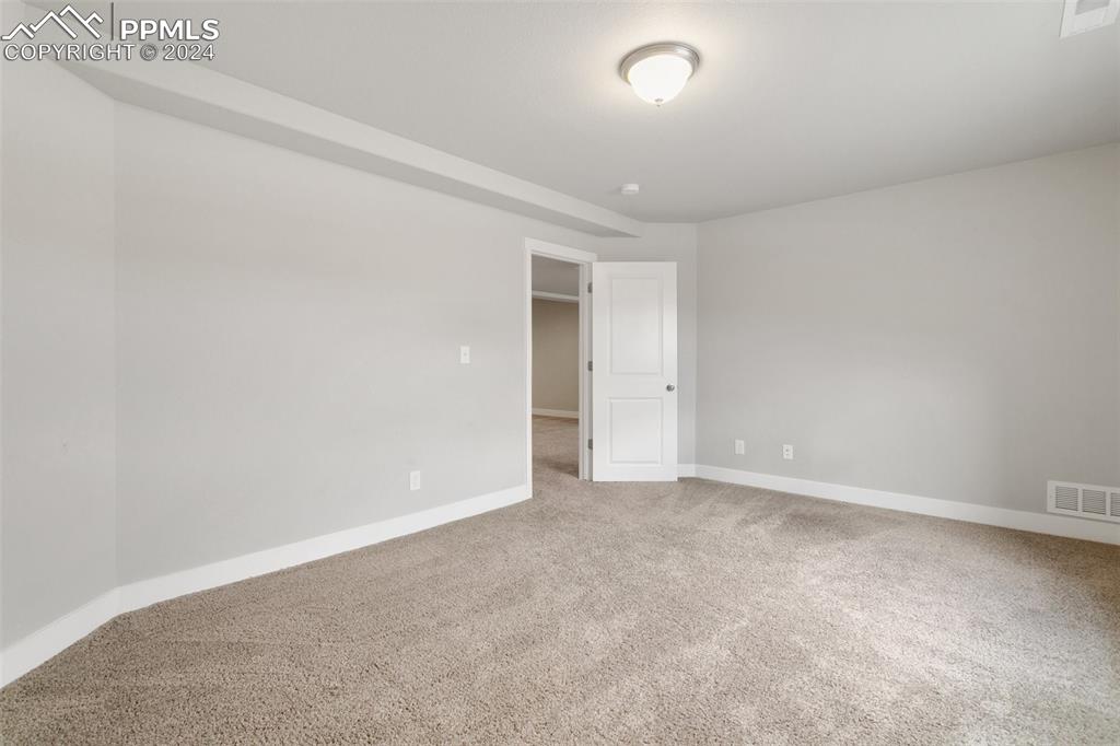 10110 Henman Terrace Peyton, CO 80831 - Photo 34 of 36 an empty room with an entryway