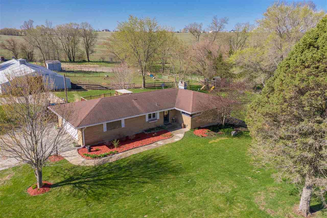 14588 Freeport Road Durand, IL 61024 - Photo 1 of 25 a view of backyard with swimming pool and trees