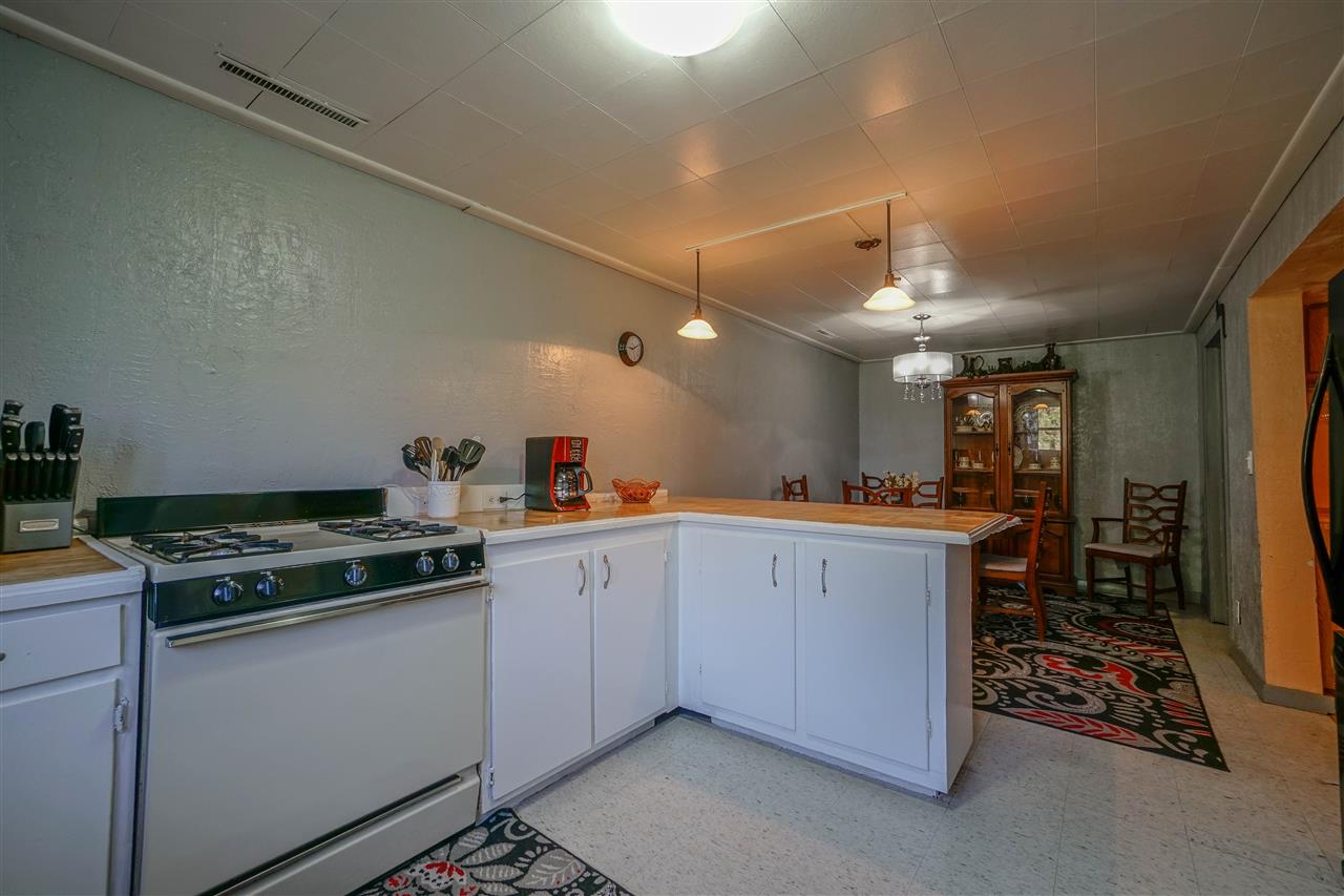 14588 Freeport Road Durand, IL 61024 - Photo 19 of 25 a kitchen with a sink cabinets and appliances