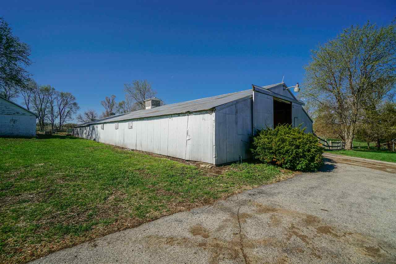 14588 Freeport Road Durand, IL 61024 - Photo 21 of 25 a view of a backyard of the house