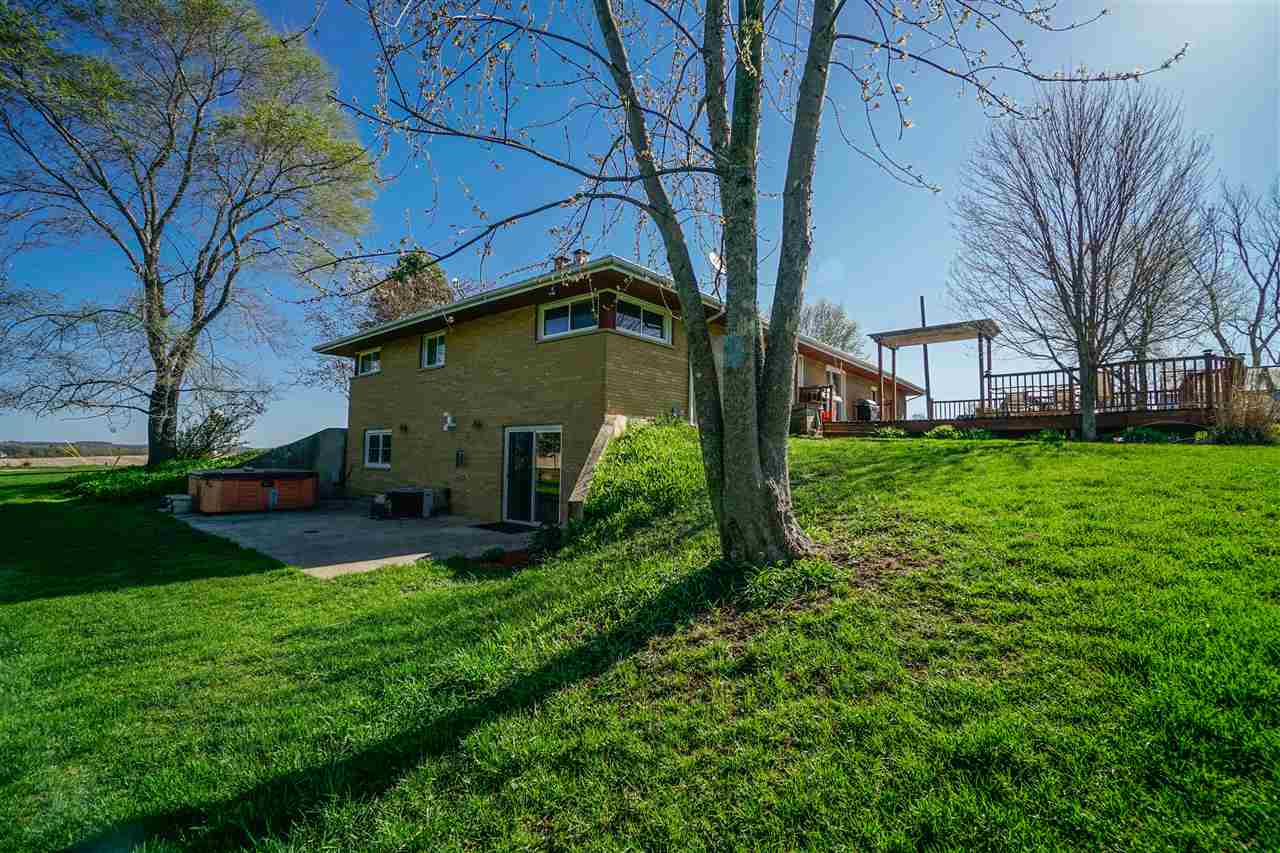 14588 Freeport Road Durand, IL 61024 - Photo 3 of 25 a view of a back yard of the house