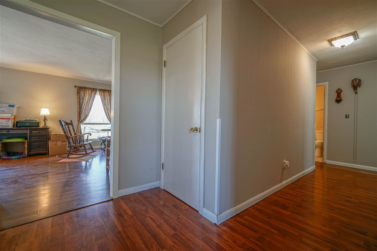 14588 Freeport Road Durand, IL 61024 - Photo 8 of 25 a view of a hallway view with wooden floor and staircase
