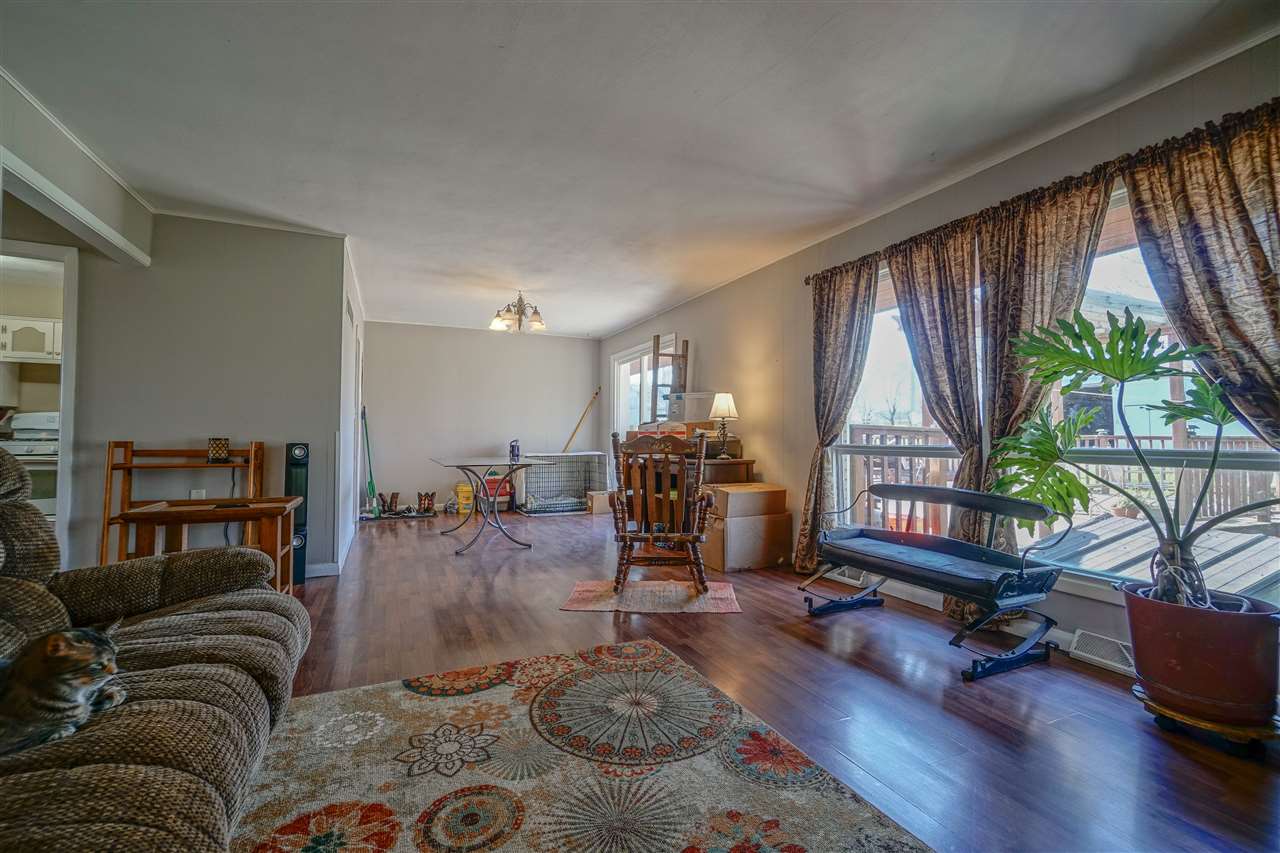 14588 Freeport Road Durand, IL 61024 - Photo 10 of 25 a living room with furniture and a large window