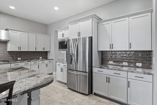 a bedroom with a bed and a potted plant