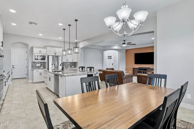 a bed room with a bed and a chair