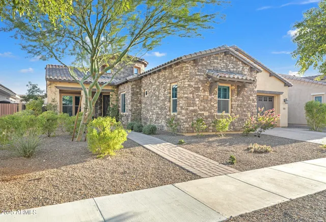 a view of a house with a yard and plants