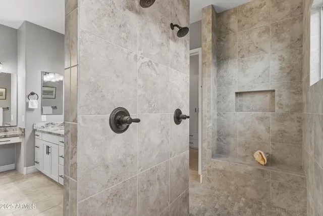 a view of a patio with table and chairs and floor to ceiling window