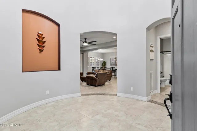 a kitchen with granite countertop a sink a counter top space and stainless steel appliances