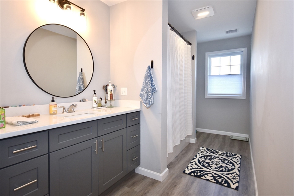 550 Spring Street, Unit 2 Fall River, MA 02721 - Photo 11 of 13 a bathroom with a sink and a mirror