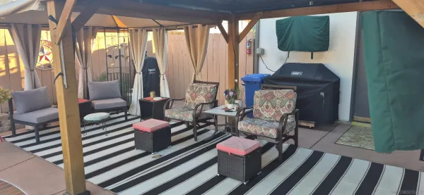 a bedroom with furniture and a window