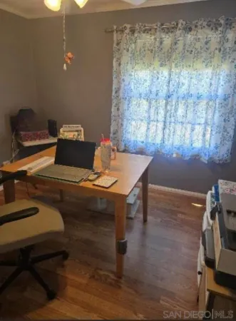 a workspace with furniture and wooden floor