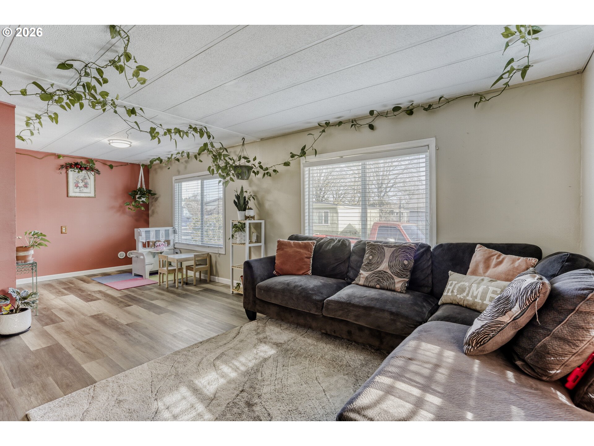 4965 Southwest Westview Drive, Unit 15 Cornelius, OR 97113 - Photo 8 of 29 a living room with furniture and a large window