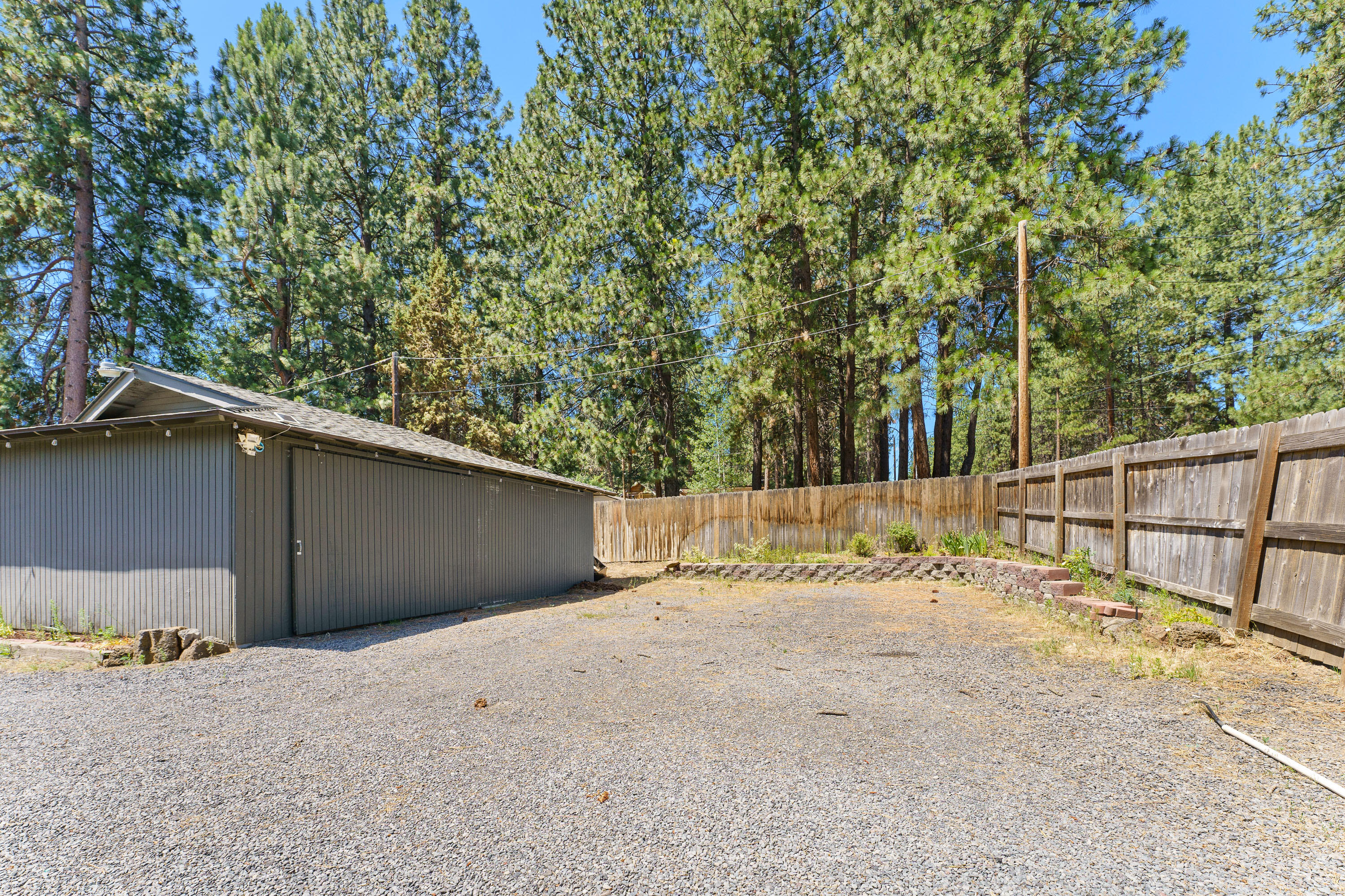 19143 Pumice Butte Road Bend, OR 97702 - Photo 13 of 19 a view of backyard space and trees