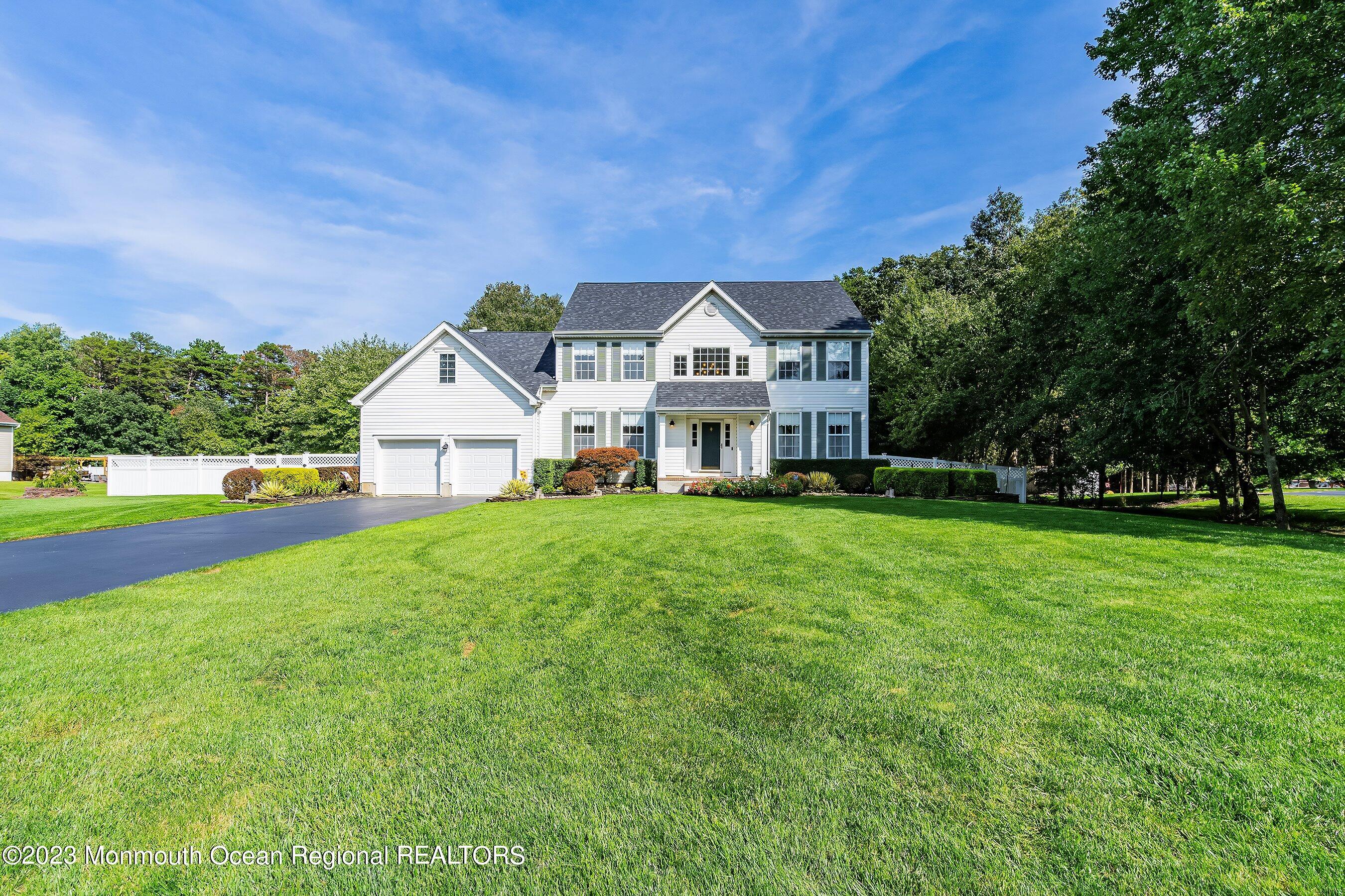 23 Harvey Jones Drive Jackson, NJ 08527 - Photo 1 of 5 a front view of a house with yard and green space