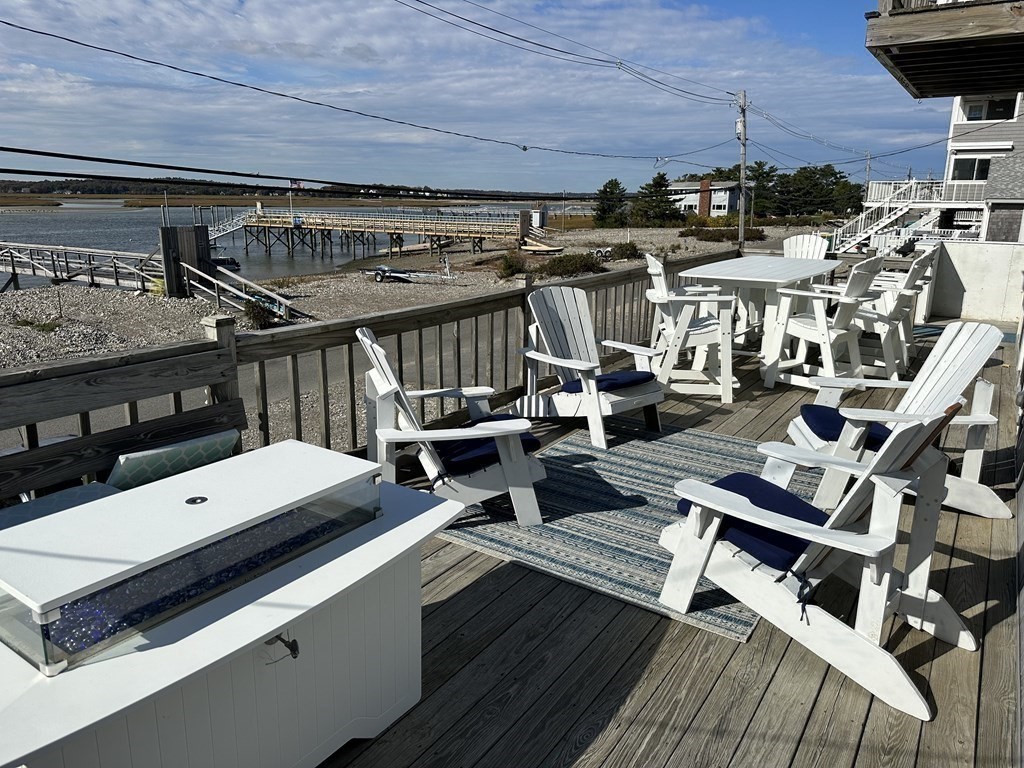 230 Central Avenue Scituate, MA 02050 - Photo 13 of 34 a view of a balcony with chairs and wooden floor