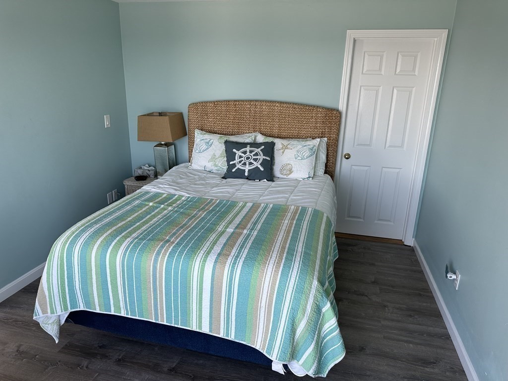 230 Central Avenue Scituate, MA 02050 - Photo 18 of 34 a bedroom with a bed and wooden floor