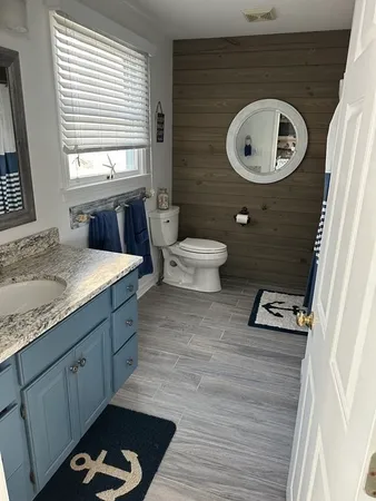 a bedroom with two beds and a window