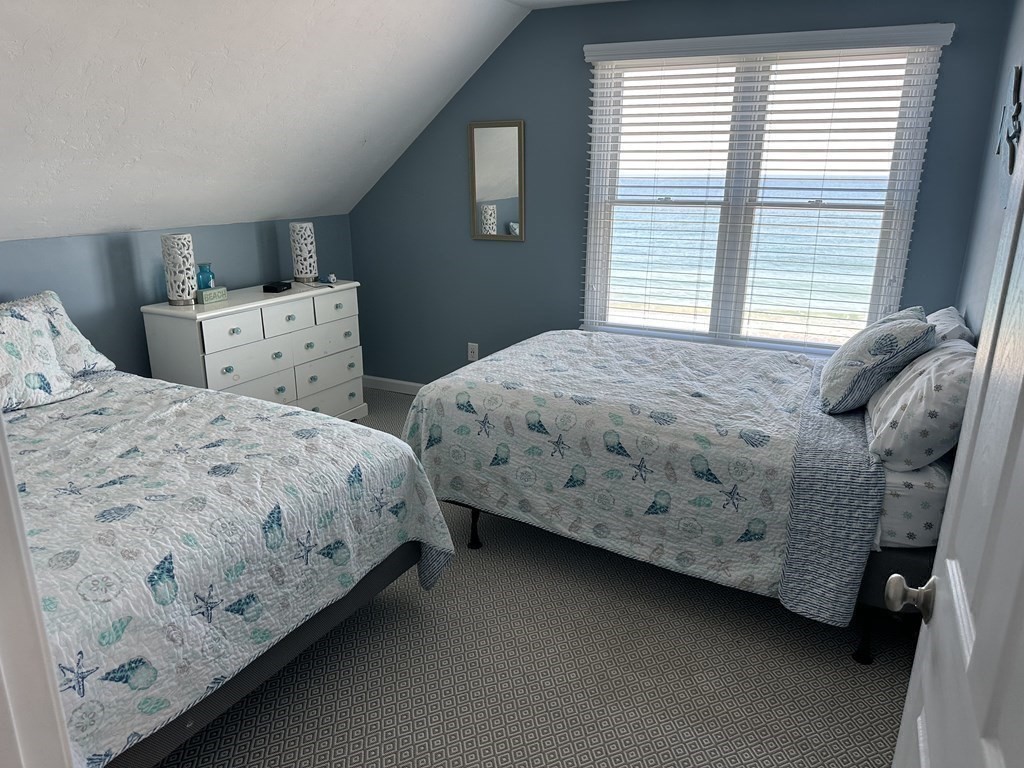 230 Central Avenue Scituate, MA 02050 - Photo 22 of 34 a bedroom with a bed and windows